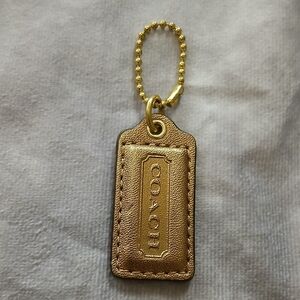 Coach gold leather accessory
